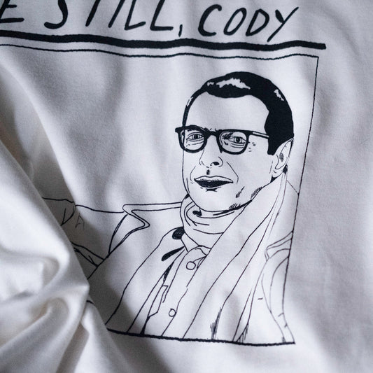 close up of drawing of jeff goldblum's face in the life aquatic by wes anderson. illustrated and screen printed on a white t shirt